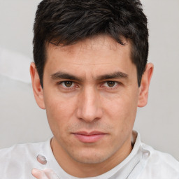 Neutral white adult male with short  brown hair and brown eyes
