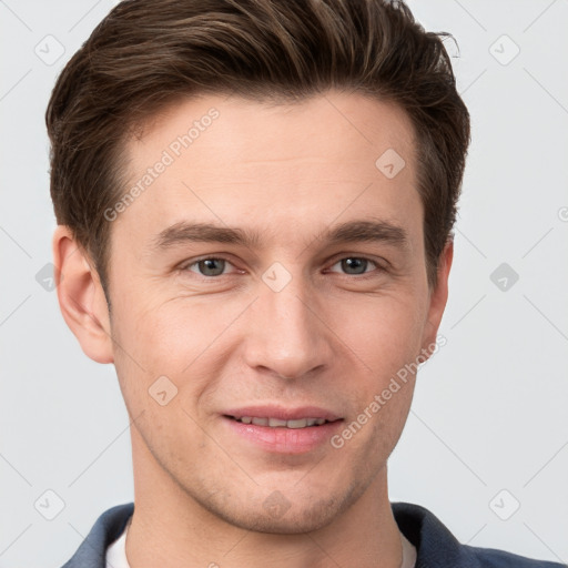 Joyful white young-adult male with short  brown hair and grey eyes