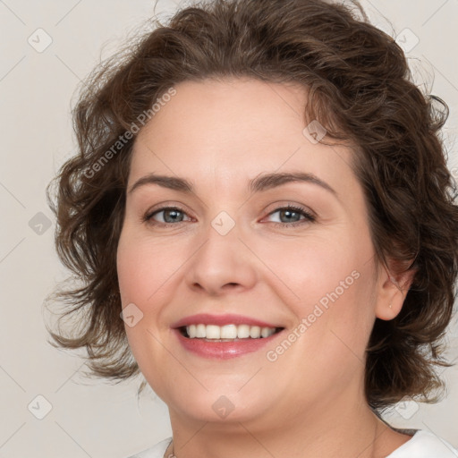 Joyful white young-adult female with medium  brown hair and green eyes