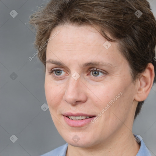 Joyful white adult female with short  brown hair and brown eyes