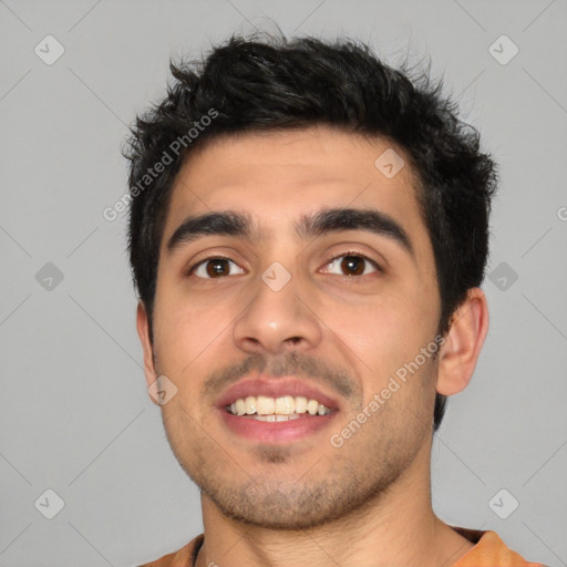 Joyful white young-adult male with short  black hair and brown eyes