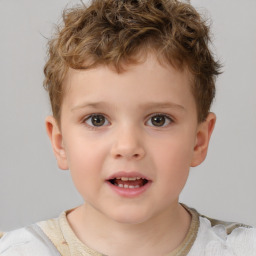 Joyful white child male with short  brown hair and brown eyes