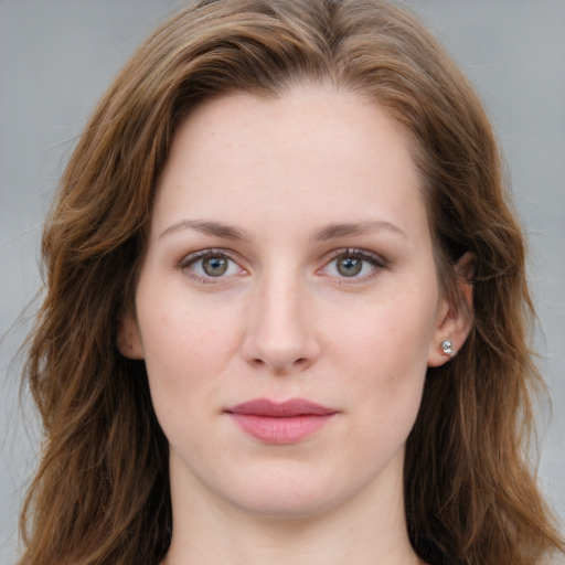 Joyful white young-adult female with long  brown hair and blue eyes