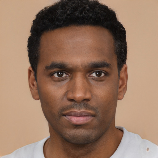 Neutral black young-adult male with short  black hair and brown eyes