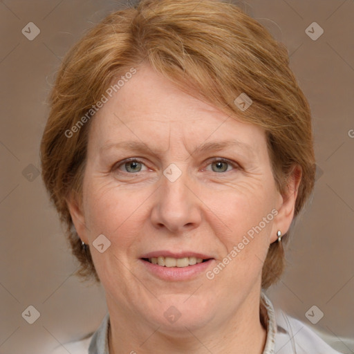 Joyful white adult female with medium  brown hair and blue eyes