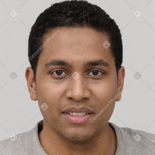 Joyful black young-adult male with short  black hair and brown eyes