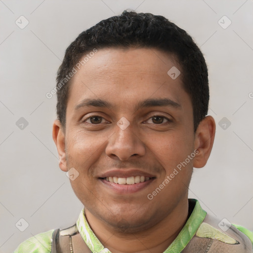 Joyful latino young-adult male with short  brown hair and brown eyes