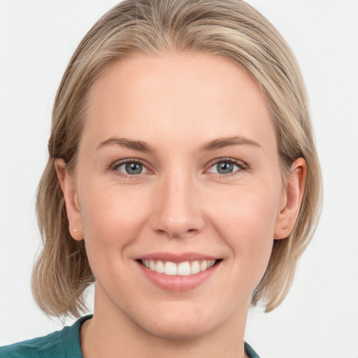 Joyful white young-adult female with medium  brown hair and blue eyes