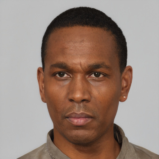 Neutral black adult male with short  black hair and brown eyes