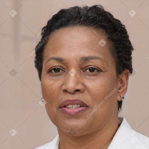 Joyful black adult female with short  brown hair and brown eyes