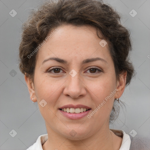 Joyful white adult female with short  brown hair and brown eyes