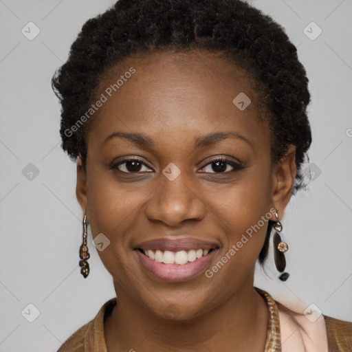 Joyful black young-adult female with long  brown hair and brown eyes