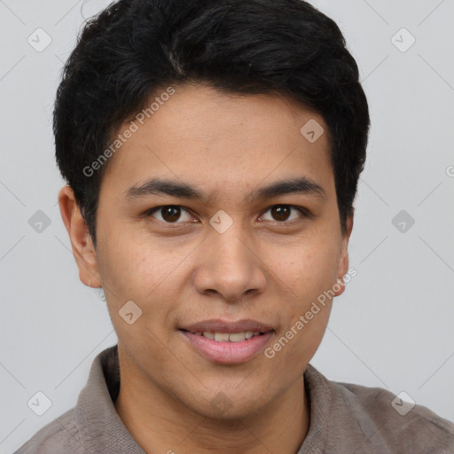 Joyful latino young-adult male with short  brown hair and brown eyes