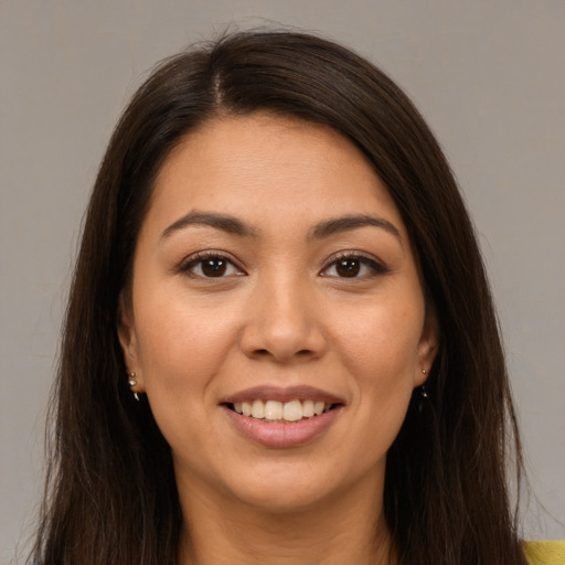 Joyful white young-adult female with long  brown hair and brown eyes