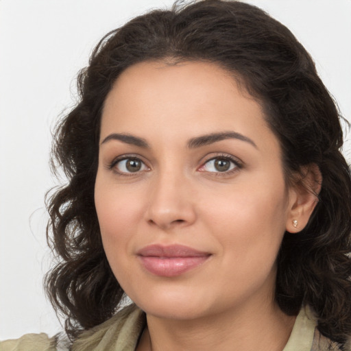 Joyful white young-adult female with long  brown hair and brown eyes