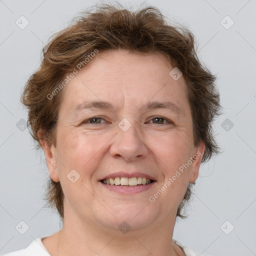 Joyful white adult female with short  brown hair and brown eyes