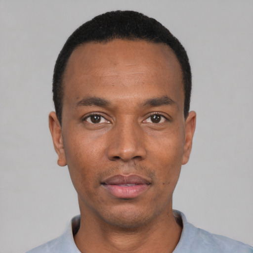 Neutral black young-adult male with short  black hair and brown eyes