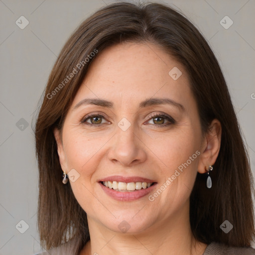 Joyful white adult female with medium  brown hair and grey eyes