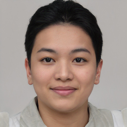 Joyful asian young-adult female with short  black hair and brown eyes