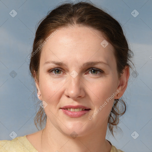 Joyful white adult female with medium  brown hair and grey eyes