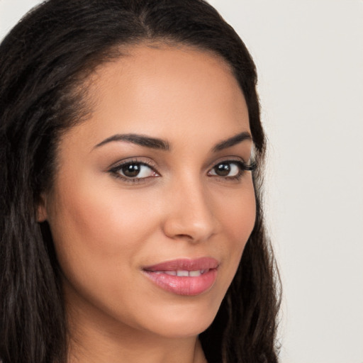 Joyful latino young-adult female with long  brown hair and brown eyes