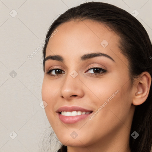 Joyful white young-adult female with long  brown hair and brown eyes