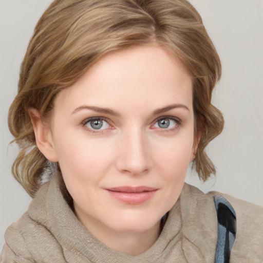 Joyful white young-adult female with medium  brown hair and blue eyes