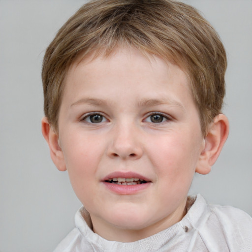 Joyful white child male with short  brown hair and brown eyes