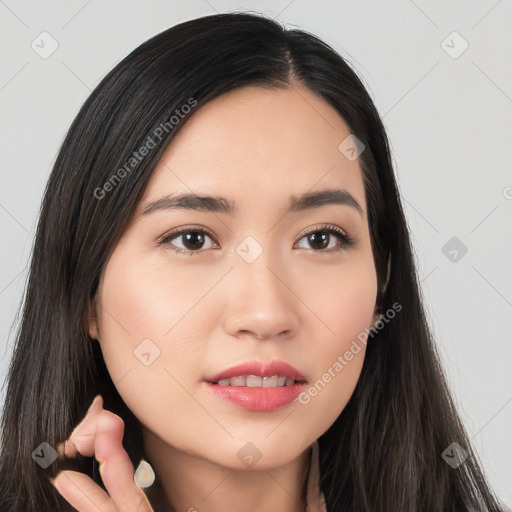 Joyful white young-adult female with long  black hair and brown eyes