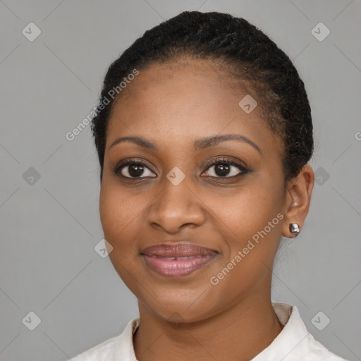 Joyful black young-adult female with short  brown hair and brown eyes