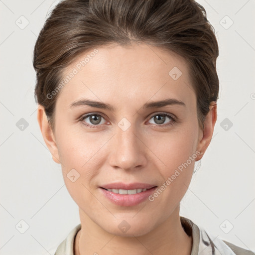 Joyful white young-adult female with short  brown hair and grey eyes