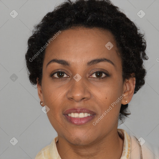 Joyful black young-adult female with short  brown hair and brown eyes