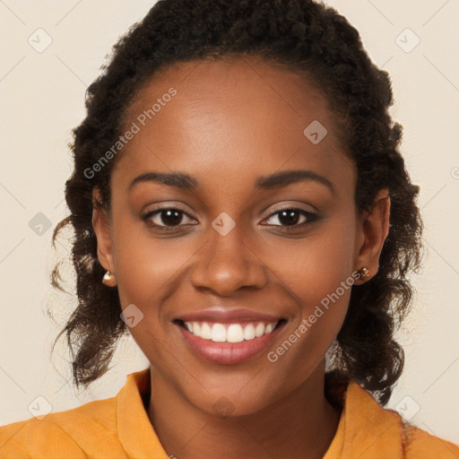 Joyful black young-adult female with long  brown hair and brown eyes