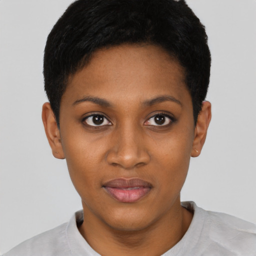 Joyful black young-adult female with short  black hair and brown eyes
