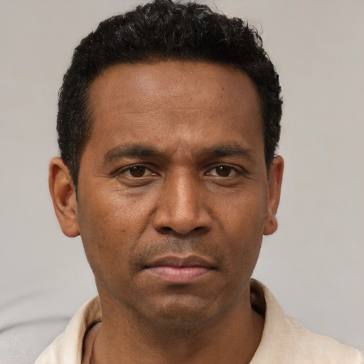 Neutral latino young-adult male with short  brown hair and brown eyes