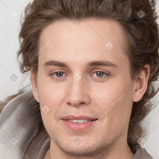 Joyful white young-adult male with medium  brown hair and brown eyes