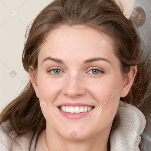 Joyful white young-adult female with medium  brown hair and blue eyes