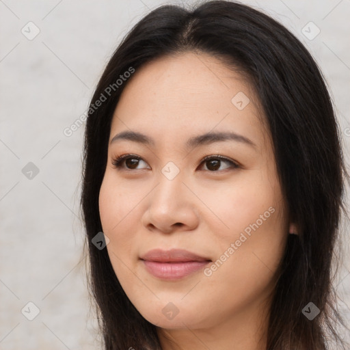 Joyful asian young-adult female with long  brown hair and brown eyes