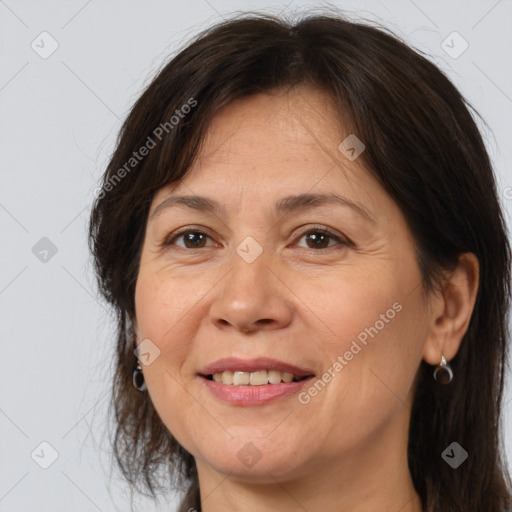 Joyful white adult female with medium  brown hair and brown eyes