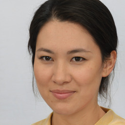 Joyful white young-adult female with medium  brown hair and brown eyes