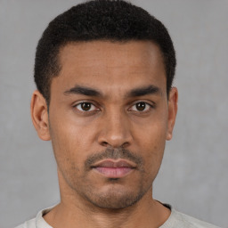 Neutral latino young-adult male with short  brown hair and brown eyes