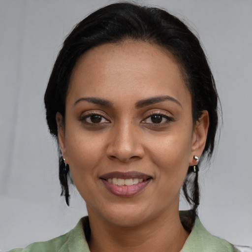 Joyful asian young-adult female with medium  black hair and brown eyes