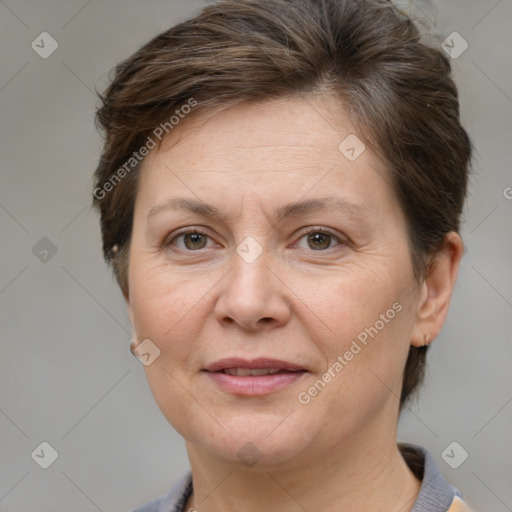 Joyful white adult female with short  brown hair and brown eyes