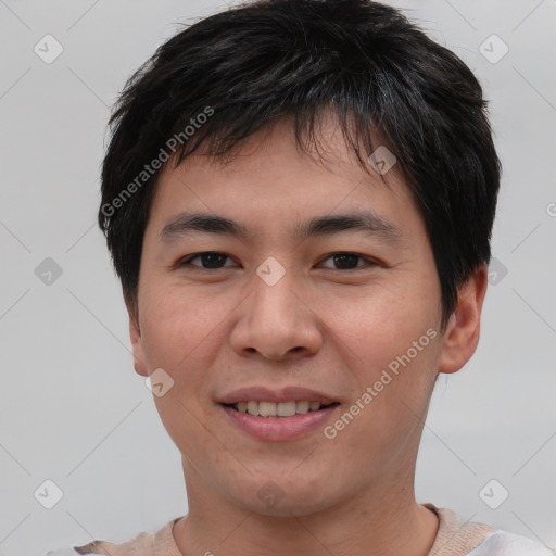 Joyful asian young-adult male with short  brown hair and brown eyes