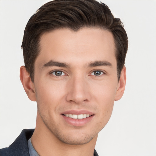 Joyful white young-adult male with short  brown hair and grey eyes