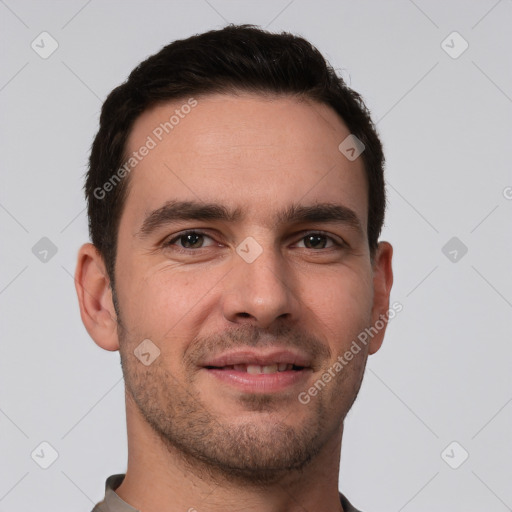 Joyful white young-adult male with short  brown hair and brown eyes