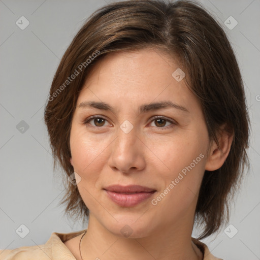 Joyful white young-adult female with medium  brown hair and brown eyes