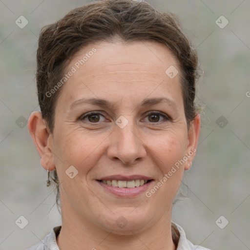 Joyful white adult female with medium  brown hair and brown eyes