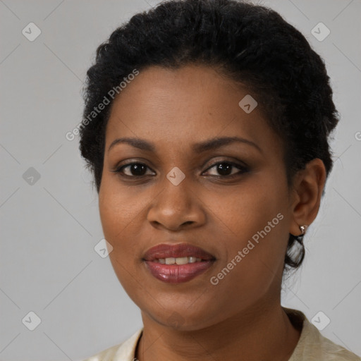 Joyful black young-adult female with short  black hair and brown eyes