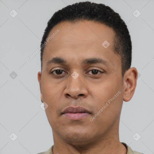 Neutral latino young-adult male with short  black hair and brown eyes